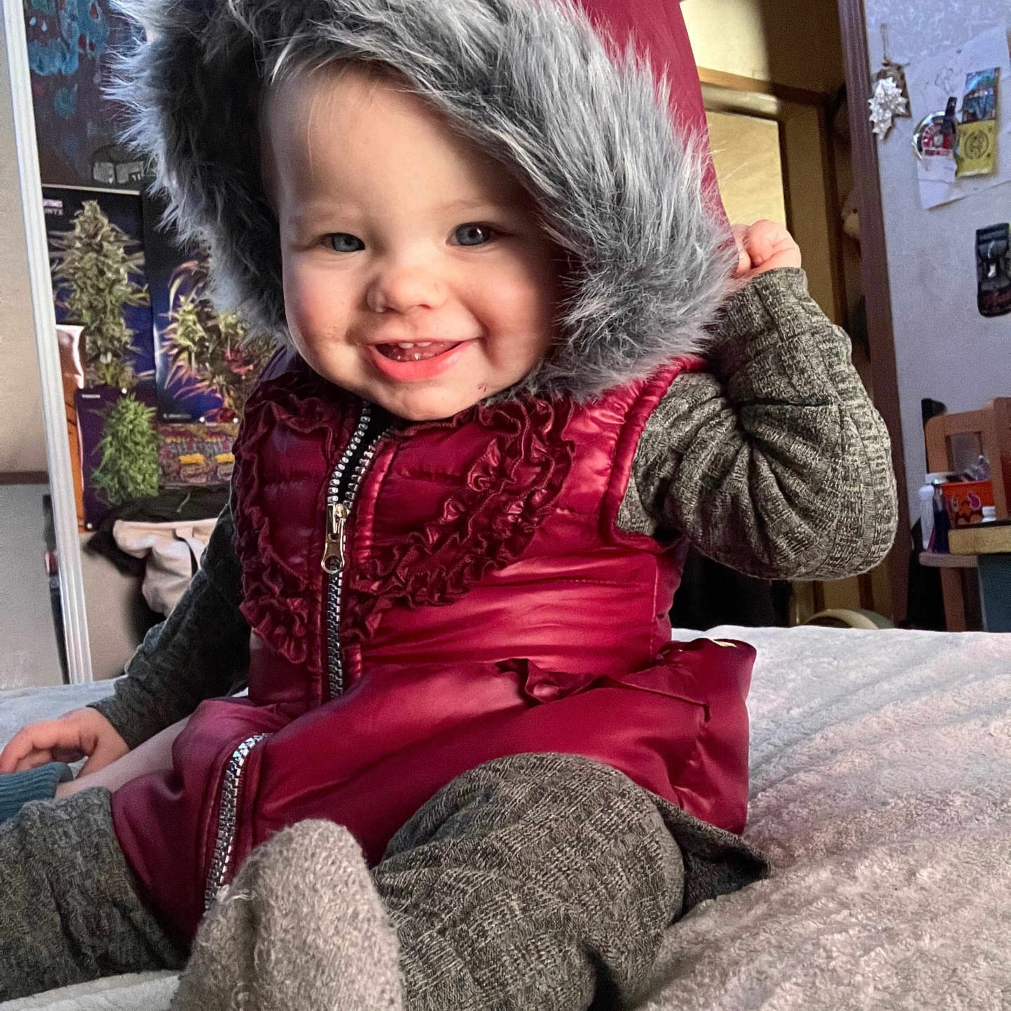 Mellydi is registered to the contest to win money with this photo: baby, clothing, coat, face, furniture, happy, hat, head, hood, hoodie, hosiery, jacket, knitwear, person, photography, portrait, smile, sock, sweater, sweatshirt