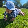 baby, blue_hat, grass, outdoor, sunny, child, crawling, daisies, greenery, nature, daylight, cute, young_child, summer, shirt, striped_clothing, headwear, portrait, person, playtime