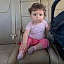 Yasmina joined the competition — help win amazing prizes! baby, child, car_interior, backseat, pink_clothing, socks, leather_seat, car_seat, curious_expression, infant, person, vehicle, seatbelt, headrest, window, daylight, casual, portrait, indoor, cute