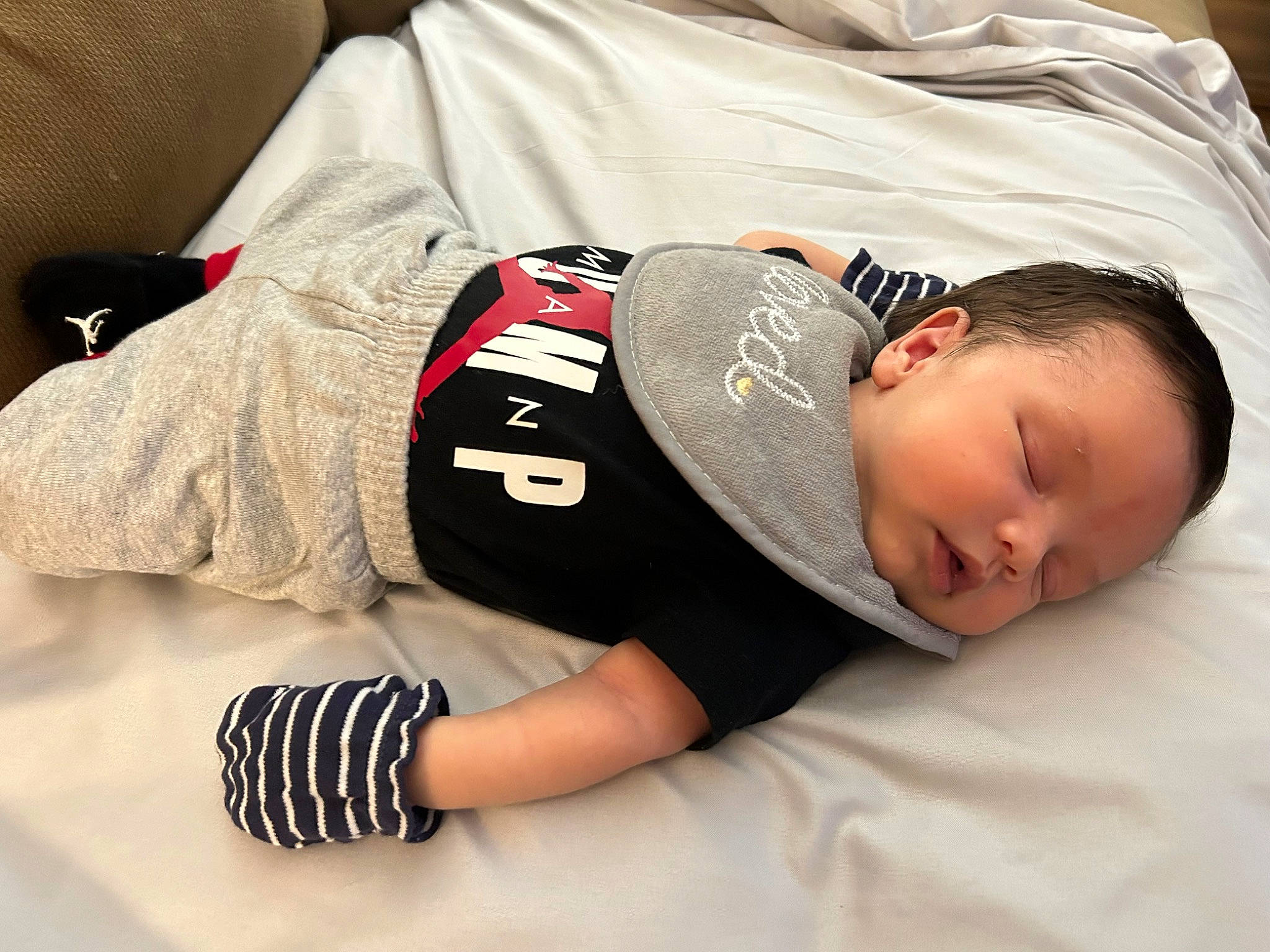 Alexander is registered to the contest to win money with this photo: abdomen, baby, baby_sleeping, baby_toddler_clothing, bed, bedding, bedtime, carmine, child, comfort, elbow, font, knee, linens, person, room, sleeve, t_shirt, thigh, toddler