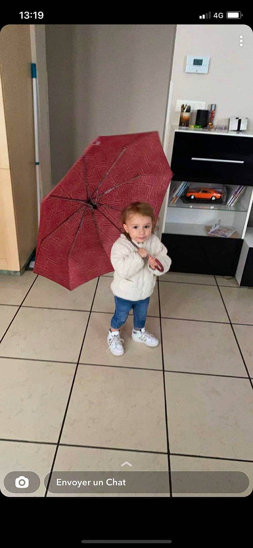 Lyana a rejoint le concours — aidez-le/la à gagner de superbes lots ! child, cooking, cooktop, fashion_accessory, floor, flooring, fun, gas_stove, hardwood, home_appliance, human_leg, kitchen, kitchen_appliance, kitchen_stove, microwave_oven, person, standing, stove, toddler, umbrella