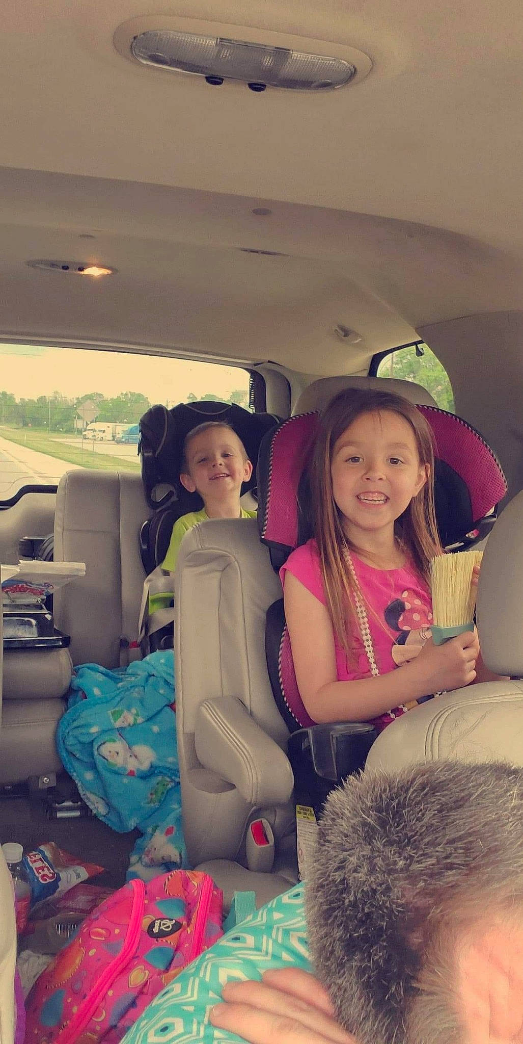 Lilyanna is registered to the contest to win money with this photo: car, car_seat, child, daughter, family_car, friendship, fun, joy, long_hair, luxury_vehicle, person, photography, selfie, sitting, smile, vacation, vehicle