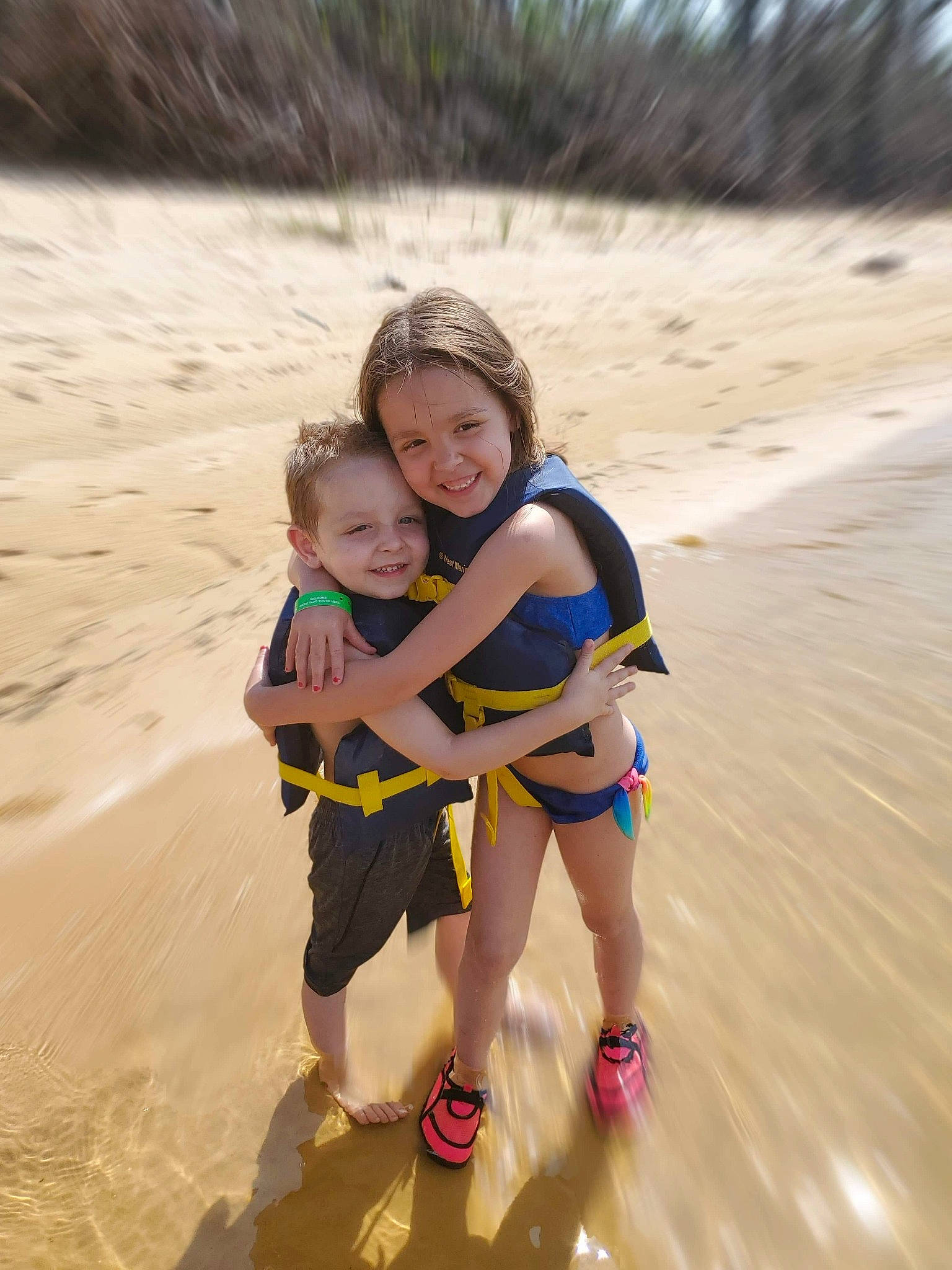 Lilyanna is registered to the contest to win money with this photo: beach, child, coast, fun, happy, joy, leisure, person, personal_protective_equipment, play, recreation, sand, sea, smile, summer, toddler, vacation, water