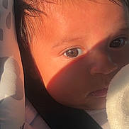 Gael joined the competition — help win amazing prizes! child, baby, car_seat, portrait, face, eyes, hair, dark_hair, sunlight, shadow, close_up, indoors, vehicle, seatbelt, blanket, fabric, cozy, looking_at_camera, infant, photography