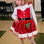 child, girl, holiday, christmas, dress, sparkly, red, white, hat, smile, pose, indoor, floor, tights, shoes, belt, earrings, number_tag, festive, confident
