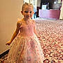 Kyah joined the competition — help win amazing prizes! child, girl, dress, pink_dress, fairy_costume, carpet, indoor, shoes, patterned_carpet, person, smiling, young_child, earrings, standing, pastel_colors, dress_up, party, event, decor, refreshments_sign