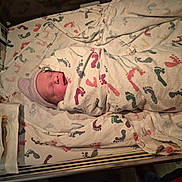 Barbra joined the competition — help win amazing prizes! newborn, baby, swaddled, blanket, hospital, bassinet, hat, sleeping, medical_equipment, monitor, footprint_pattern, sheet, infant, bedding, wrapped, face, crib, bulb_syringe, packaging, healthcare