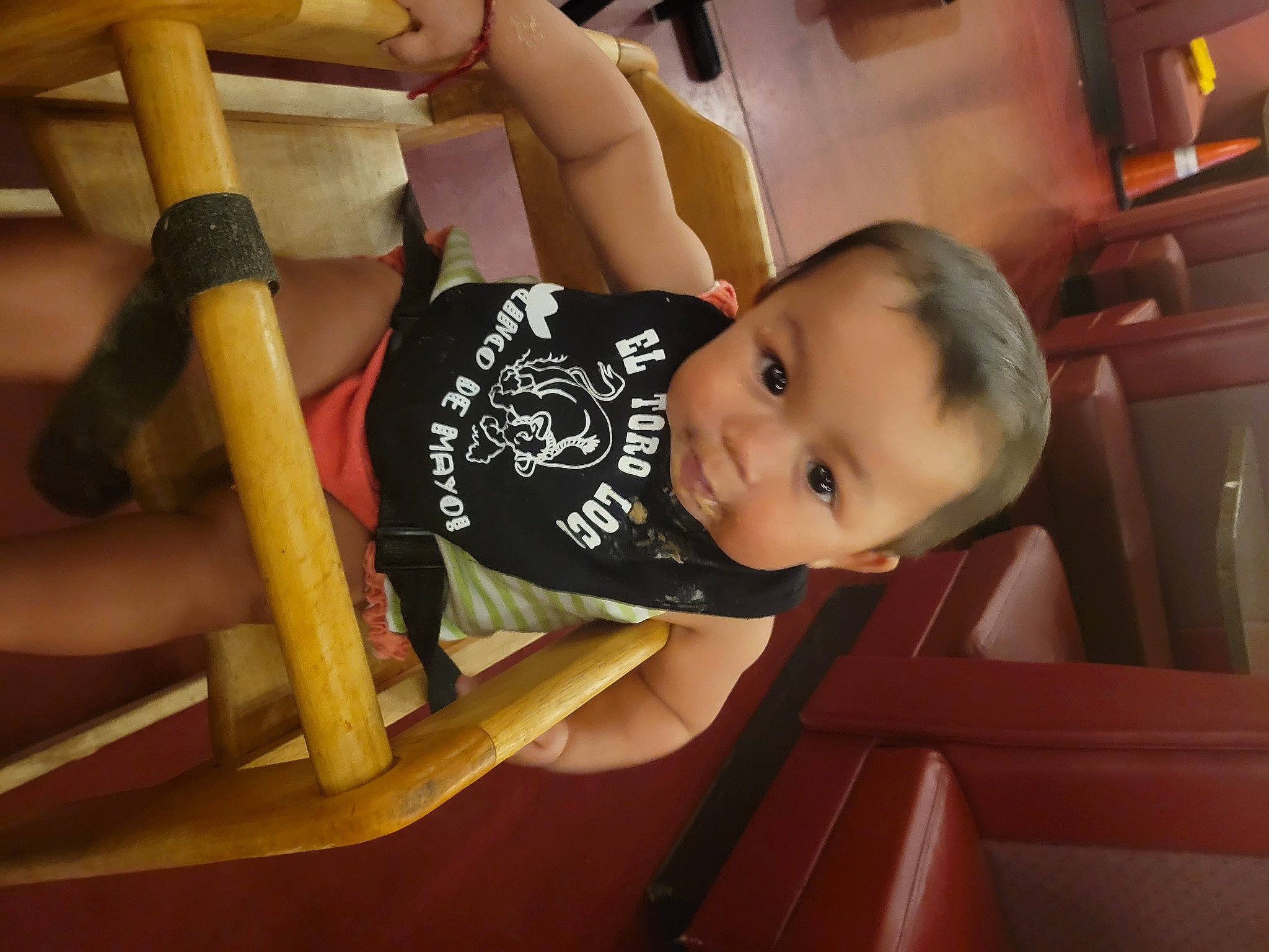 Kailany is registered to the contest to win money with this photo: baby, baby_products, baby_safety, baby_toddler_clothing, child, comfort, elbow, flooring, fun, happy, hardwood, human_leg, knee, person, sitting, smile, t_shirt, table, thigh, toddler