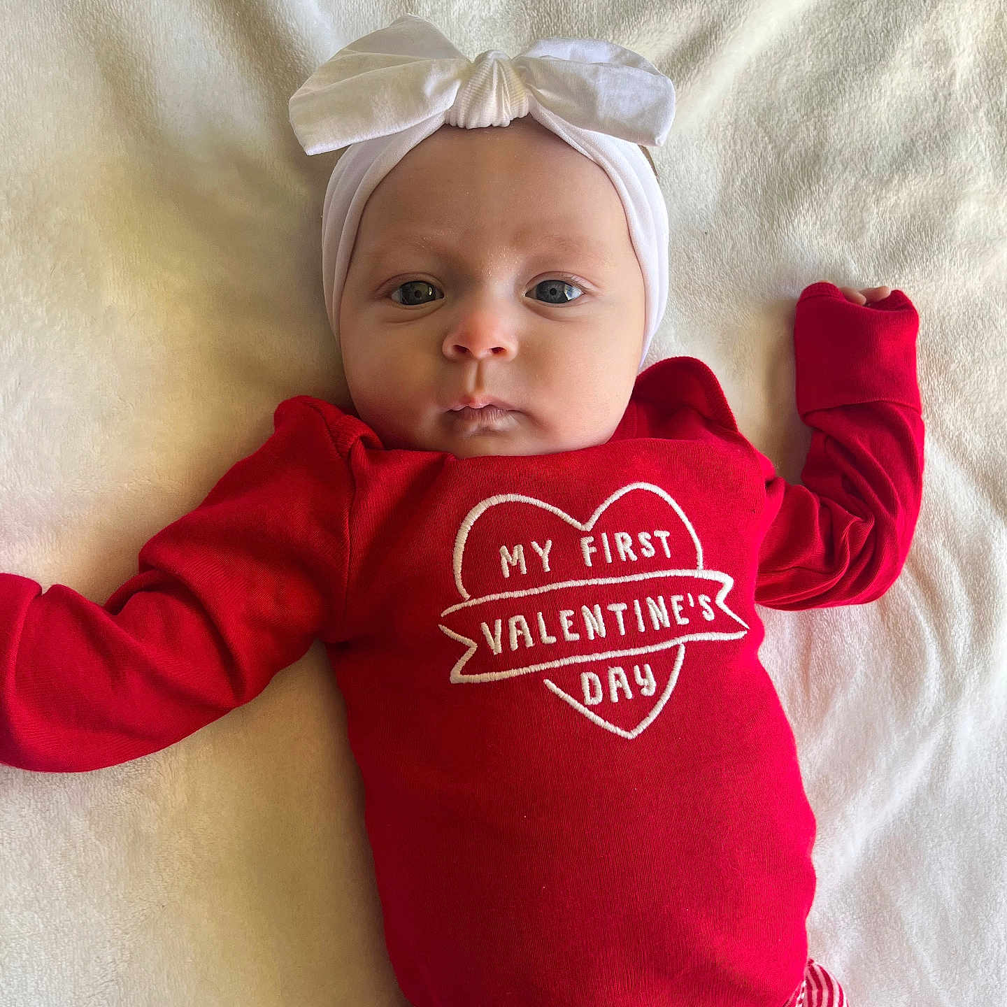 Brynlee is registered to the contest to win money with this photo: baby, bodypart, bonnet, clothing, cushion, face, finger, hand, hat, head, homedecor, hoodie, knitwear, newborn, pants, person, photography, portrait, sweater, t_shirt