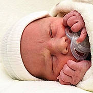 Jacob is registered to the contest to win money with this photo: newborn, baby, sleeping, pacifier, hat, blanket, closeup, infant, cute, skin, hand, face, peaceful, resting, cozy, soft, portrait, toddler, indoors, child
