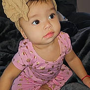 Camila joined the competition — help win amazing prizes! ankle, baby, bodypart, bonnet, cap, clothing, couch, dress, face, finger, furniture, hand, happy, hat, head, newborn, person, photography, portrait, sitting