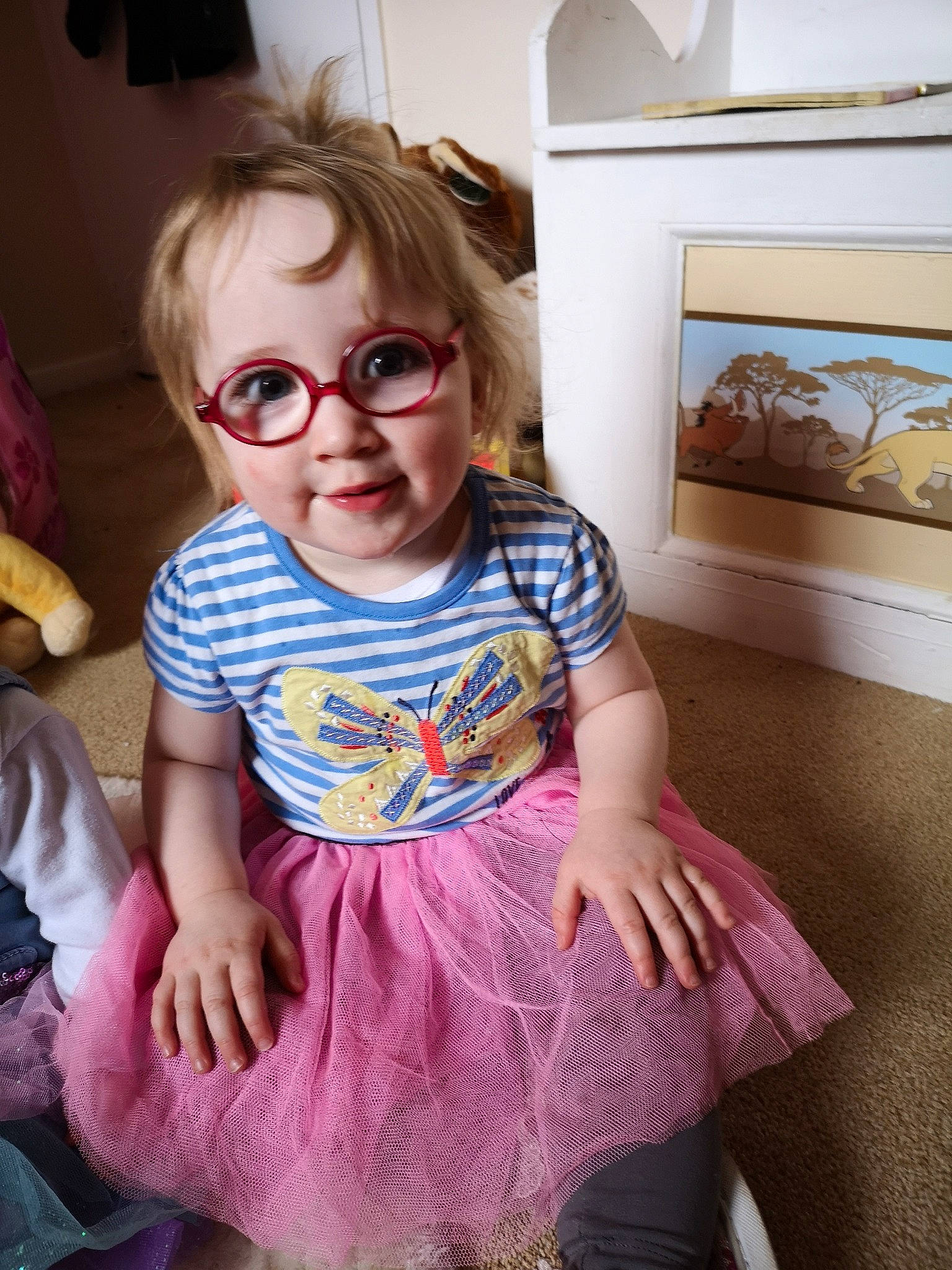 Jessica Casement is registered to the contest to win money with this photo: baby_toddler_clothing, child, cool, dress, eyewear, fun, glasses, pattern, person, pink, play, purple, sitting, sleeve, t_shirt, textile, toddler, vision_care