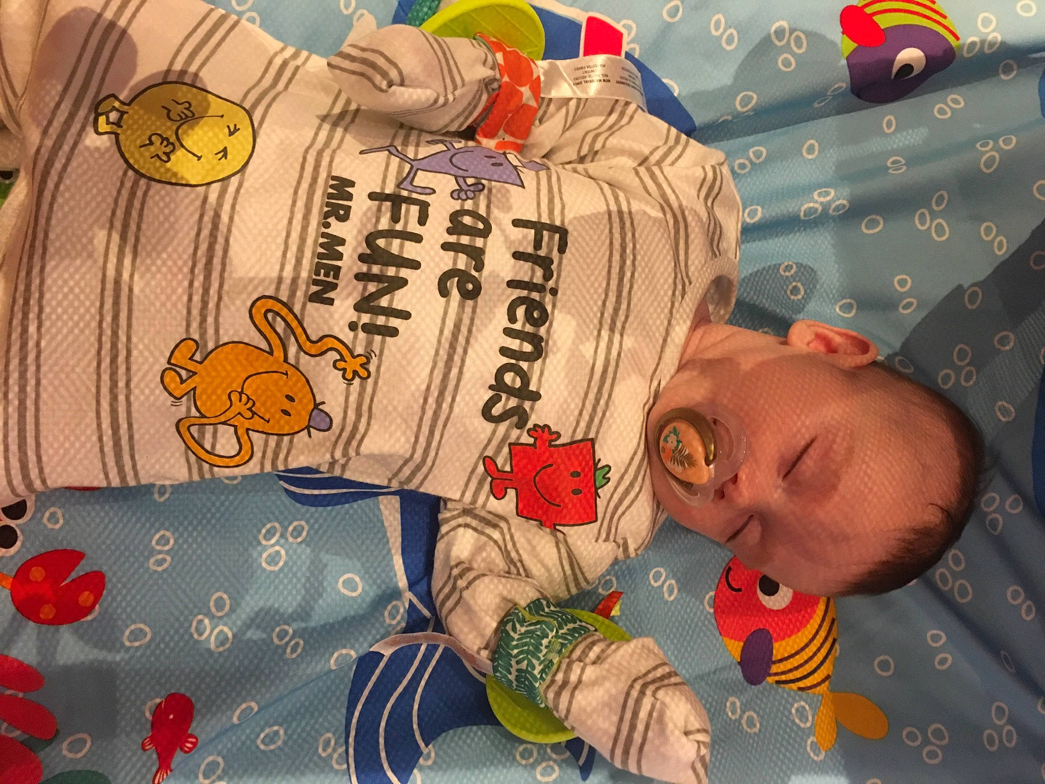 Esme is registered to the contest to win money with this photo: baby, baby_products, baby_toddler_clothing, bag, bedding, bedtime, child, comfort, font, happy, linens, orange, pattern, person, product, red, room, sleeve, textile, toddler