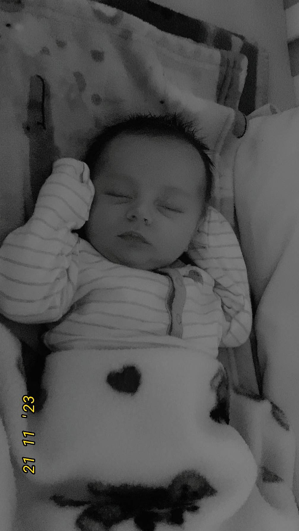 Braxton is registered to the contest to win money with this photo: arm, baby, cheek, chin, comfort, eye, eyebrow, facial_expression, hairstyle, head, iris, lip, mouth, nose, organ, person, product, skin, smile, textile