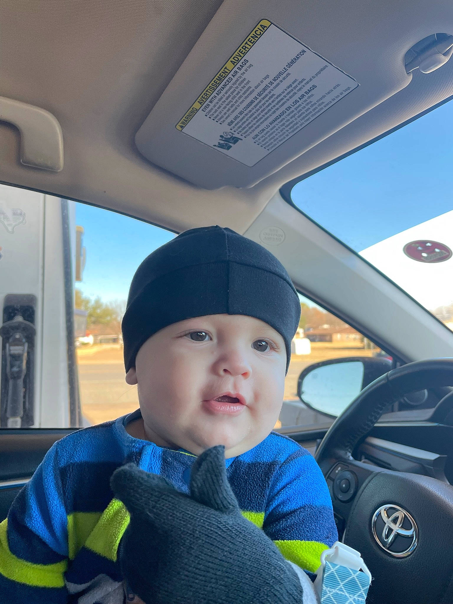 Azriel is registered to the contest to win money with this photo: auto_part, automotive_design, automotive_exterior, baby, baby_toddler_clothing, blue, car, car_seat, car_seat_cover, electric_blue, head_restraint, headwear, motor_vehicle, person, product, seat_belt, steering_wheel, toddler, travel, vehicle