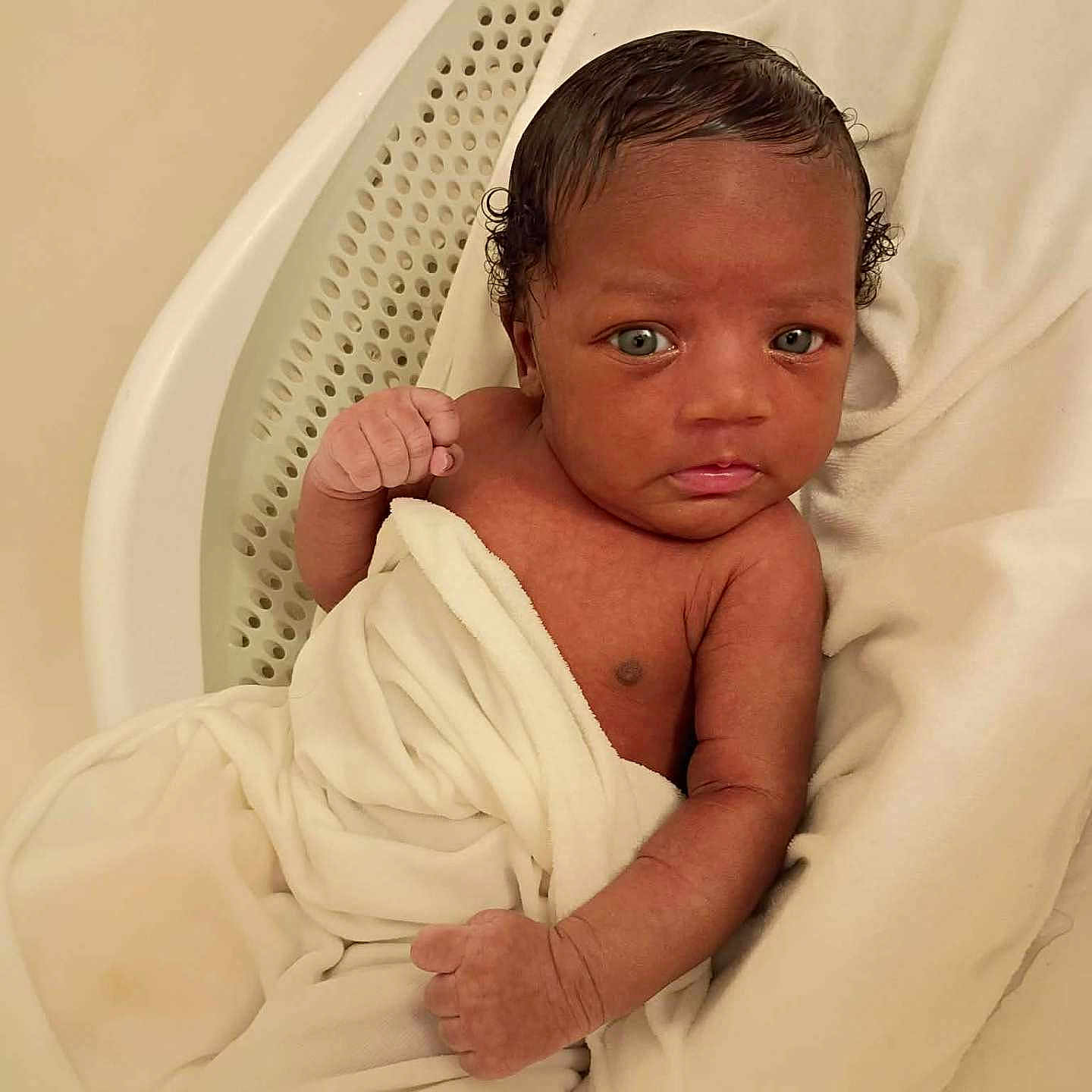 A'Merie is registered to the contest to win money with this photo: newborn, baby, infant, child, portrait, face, eyes, hair, hospital, bassinet, blanket, white, sleeping, awake, lying_down, sitting, fist, indoor, close_up, photography