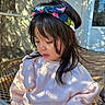 Halle joined the competition — help win amazing prizes! child, girl, headband, pink_sweatshirt, outdoor, sunlight, shadow, portrait, young_child, floral_pattern, long_hair, thoughtful, casual_clothing, nature, metal_grate, daylight, cute, fashion, closeup, person