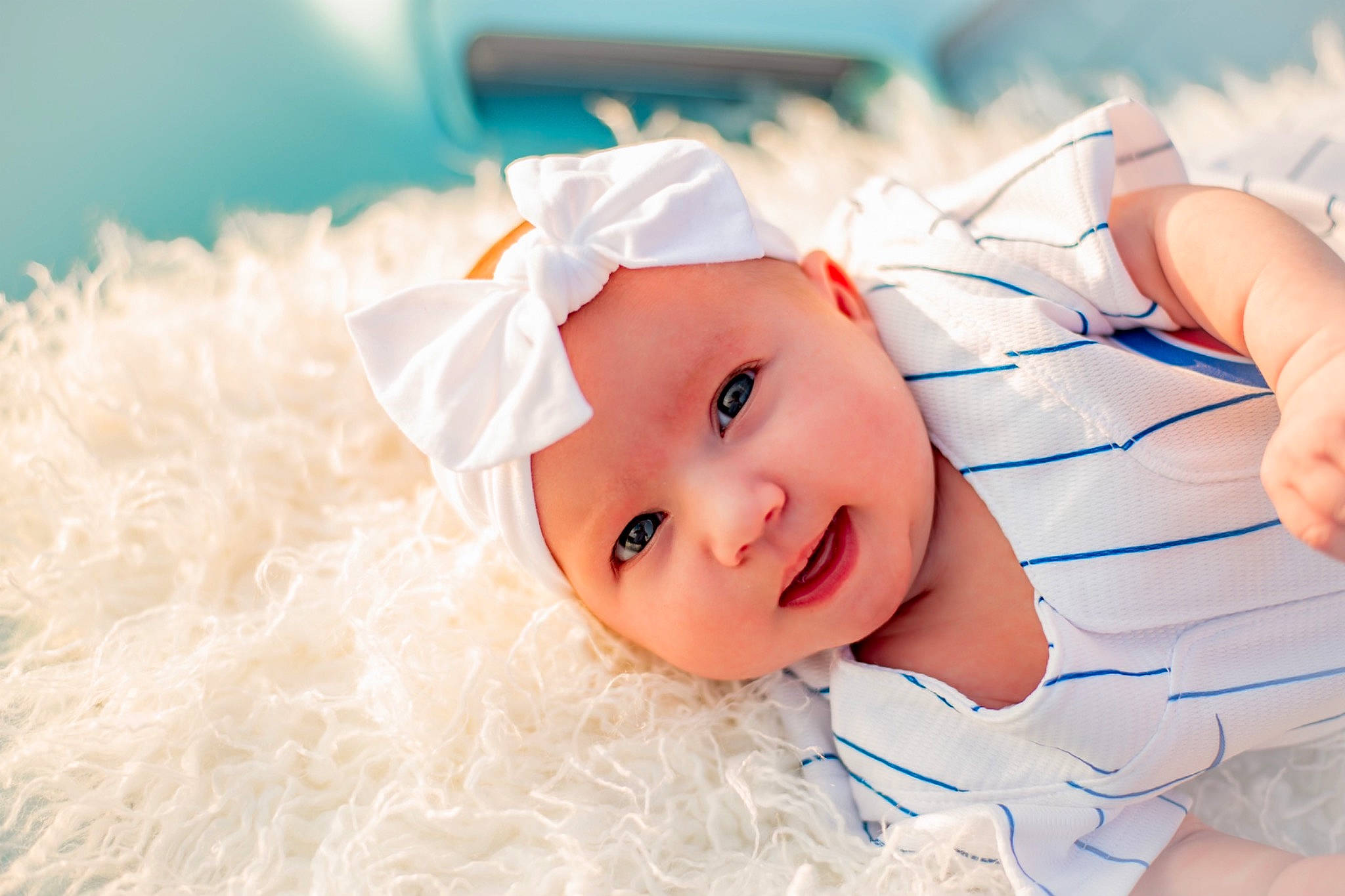 Magnolia is registered to the contest to win money with this photo: baby, baby_products, baby_toddler_clothing, child, eyelash, fashion_accessory, fun, gesture, grass, hair_accessory, happy, hat, headband, headpiece, headwear, linens, nail, person, portrait_photography, smile