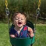 baby, child, daylight, fun, grass, green_swing, happy, holding, nature, outdoor, person, playground, playing, seat, smiling, summer, sunny, swing, toddler, yellow_chain