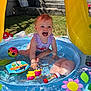 toddler, child, water, pool, toys, summer, outdoor, play, splashing, colorful, sunlight, happy, smiling, plastic, flower, ladybug, grass, swimsuit, backyard, fun