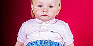 Noëlya a rejoint le concours — aidez-le/la à gagner de superbes lots ! toddler, child, pigtails, pink_shirt, blue_jeans, wooden_crate, studio_background, portrait, serious_expression, sitting, casual_clothing, indoor, red_background, young_child, person, fashion, cute, baby, studio_lighting, closeup