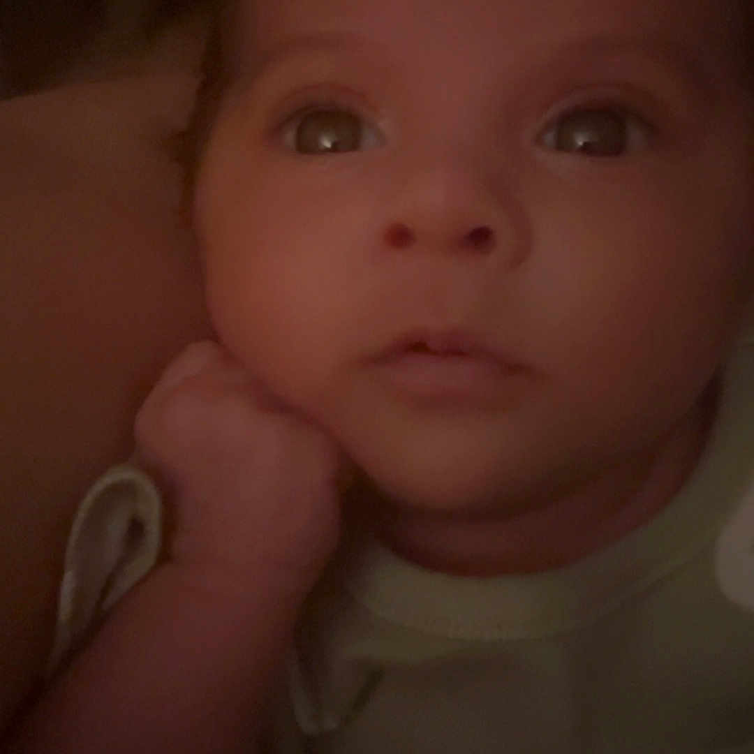 Tatiana is registered to the contest to win money with this photo: baby, blanket, bodypart, bonnet, clothing, couch, ear, face, finger, furniture, hand, happy, head, mouth, newborn, person, photography, portrait, smile, toy