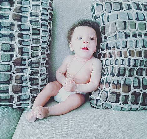 Carsyn joined the competition — help win amazing prizes! baby, baby_toddler_clothing, barefoot, chest, child, comfort, facial_expression, fashion, flash_photography, flooring, foot, hairstyle, human_leg, knee, pattern, person, sitting, stomach, thigh, toddler