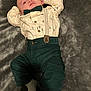 baby, infant, clothing, bow_tie, suspenders, pants, shirt, sock, blanket, lying_down, cute, portrait, soft_texture, indoors, child, young, person, apparel, comfort, relaxing
