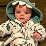 Mazen joined the competition — help win amazing prizes! baby, child, hood, robe, dinosaur, cozy, soft, cute, infant, face, hand, clothing, portrait, indoors, warm, sleepwear, fabric, smile, young, person