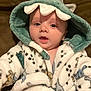 Mazen is registered to the contest to win money with this photo: baby, child, hood, blanket, dinosaur, cute, face, portrait, infant, clothing, warm, cozy, soft, expression, person, indoor, young, wearing, eyes, mouth