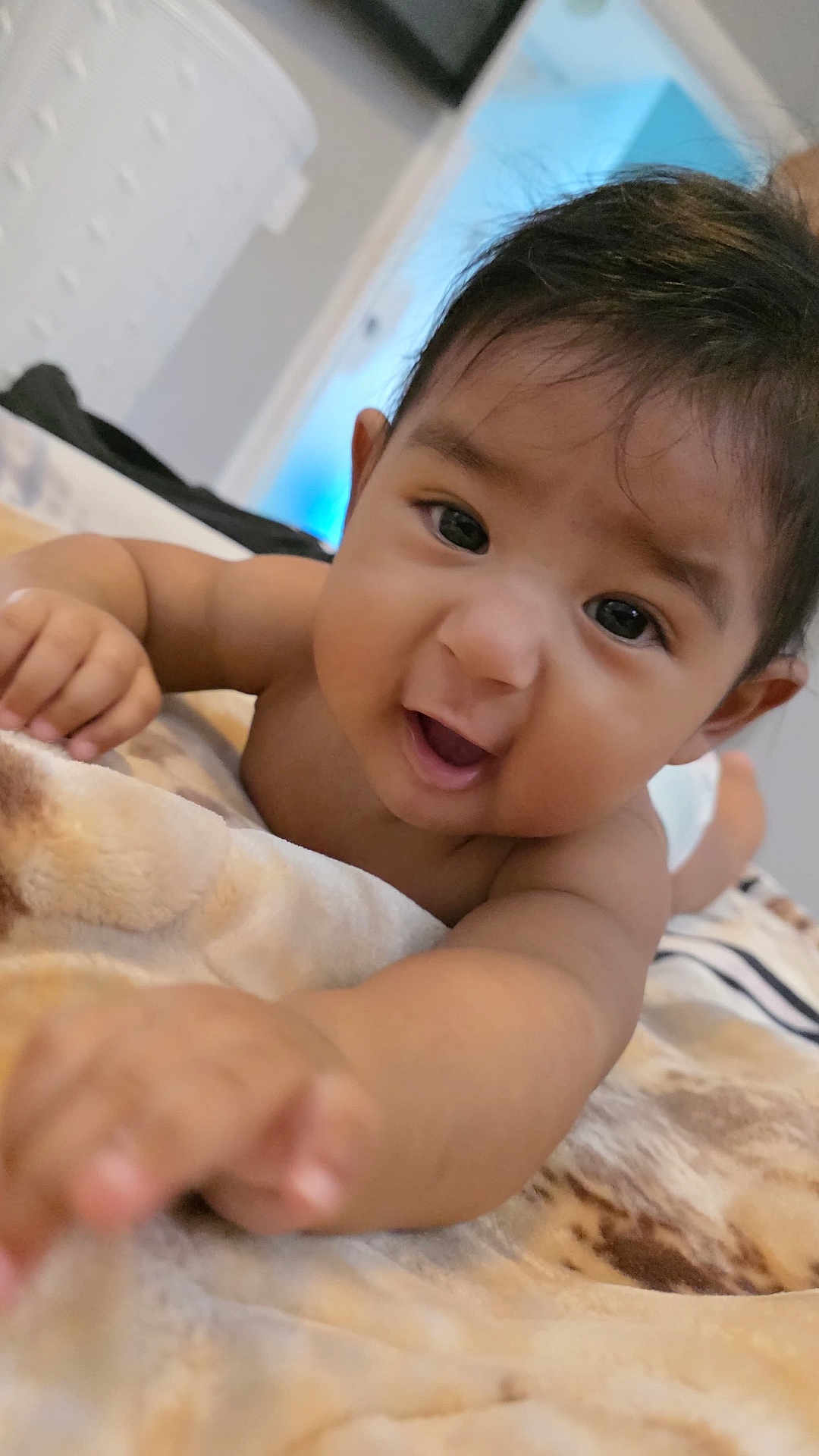 Jesús joined the competition — help win amazing prizes! baby, infant, child, face, hand, skin, eyes, blanket, indoors, portrait, cute, toddler, expression, young, person, lying_down, soft, furniture, diaper, playful