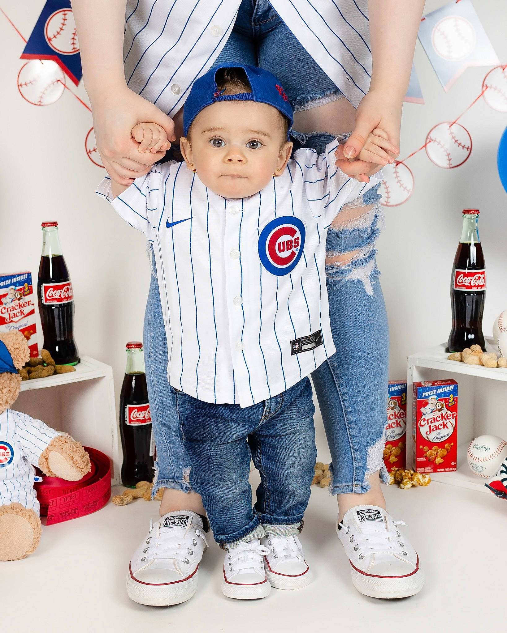 Khyree is registered to the contest to win money with this photo: baby_toddler_clothing, blue, bottle, carbonated_soft_drinks, carmine, drink, electric_blue, fun, happy, hat, headwear, pattern, person, plastic_bottle, red, room, sleeve, sportswear, t_shirt, toddler