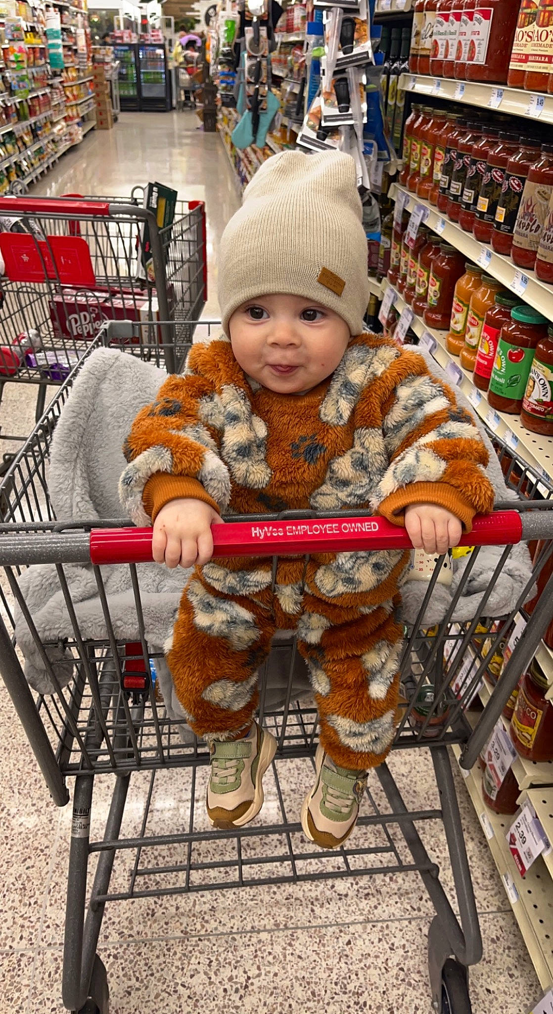 Khyree joined the competition — help win amazing prizes! cap, chair, child, city, convenience_store, customer, headwear, leisure, market, marketplace, natural_foods, person, personal_protective_equipment, retail, service, shelf, shopping, shopping_cart, sitting, smile