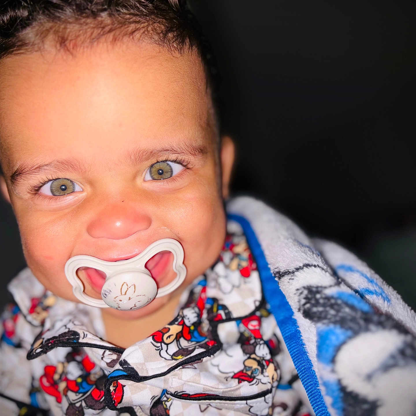 Miloh Mendoza joined the competition — help win amazing prizes! baby, blanket, child, closeup, clothing, cute, expression, eyes, face, happy, head, indoors, infant, pacifier, portrait, skin, smile, toddler, warm, young_child