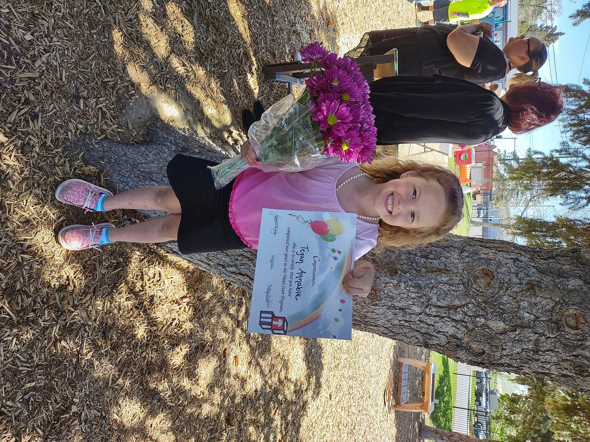 Tegan joined the competition — help win amazing prizes! flower, foot, fun, grass, happy, hat, human_leg, joy, leisure, magenta, people_in_nature, person, plant, pole, shadow, sky, smile, soil, spring, tree