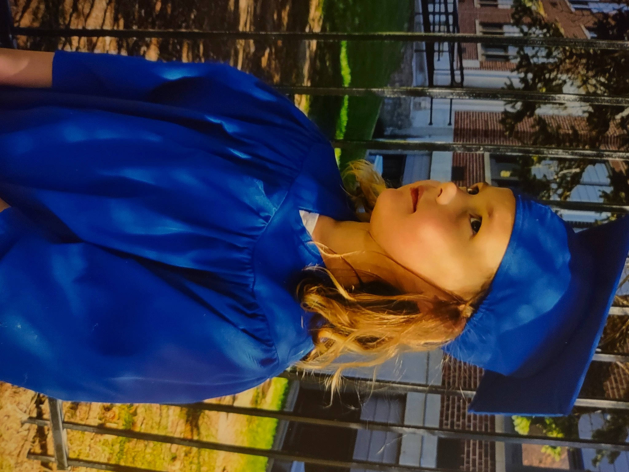 Tegan is registered to the contest to win money with this photo: costume, dress, electric_blue, eyewear, fashion_accessory, fun, happy, headwear, leisure, orange, person, personal_protective_equipment, plant, recreation, smile, tree, water, window