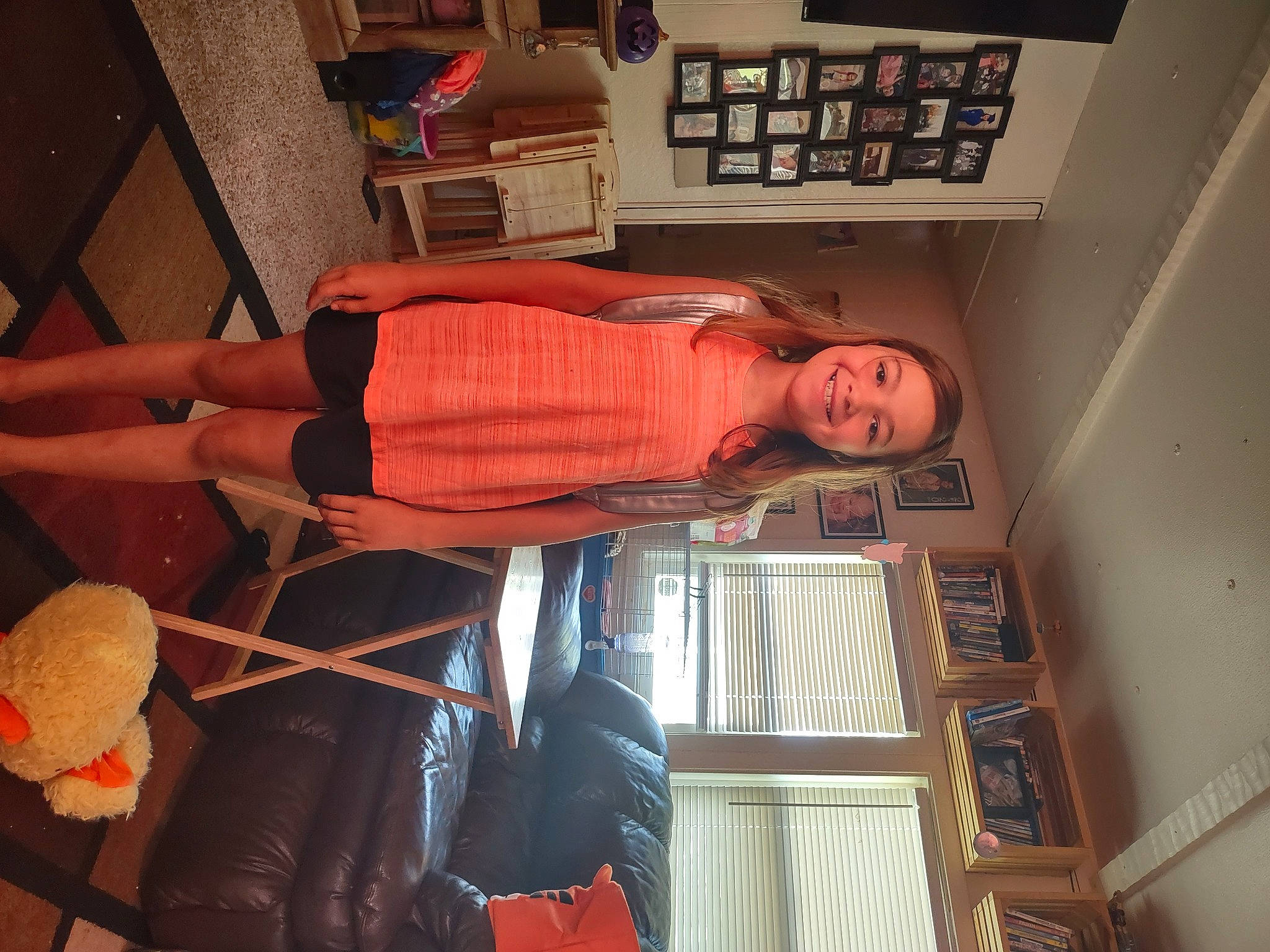 Andi joined the competition — help win amazing prizes! comfort, elbow, flesh, flooring, fun, hardwood, hat, human_body, human_leg, joy, knee, leg, person, room, shelf, shelving, thigh, wood, wrist