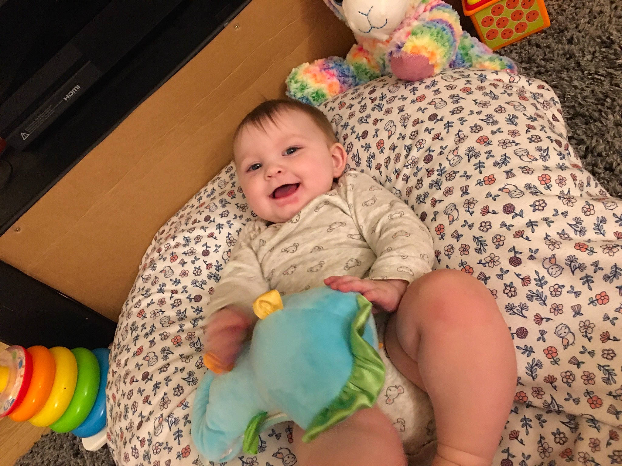 Kallie is registered to the contest to win money with this photo: baby, baby_playing_with_toys, baby_products, baby_toddler_clothing, baby_toys, child, comfort, human, joy, person, plastic, play, plush, sock, stuffed_toy, toddler, toy