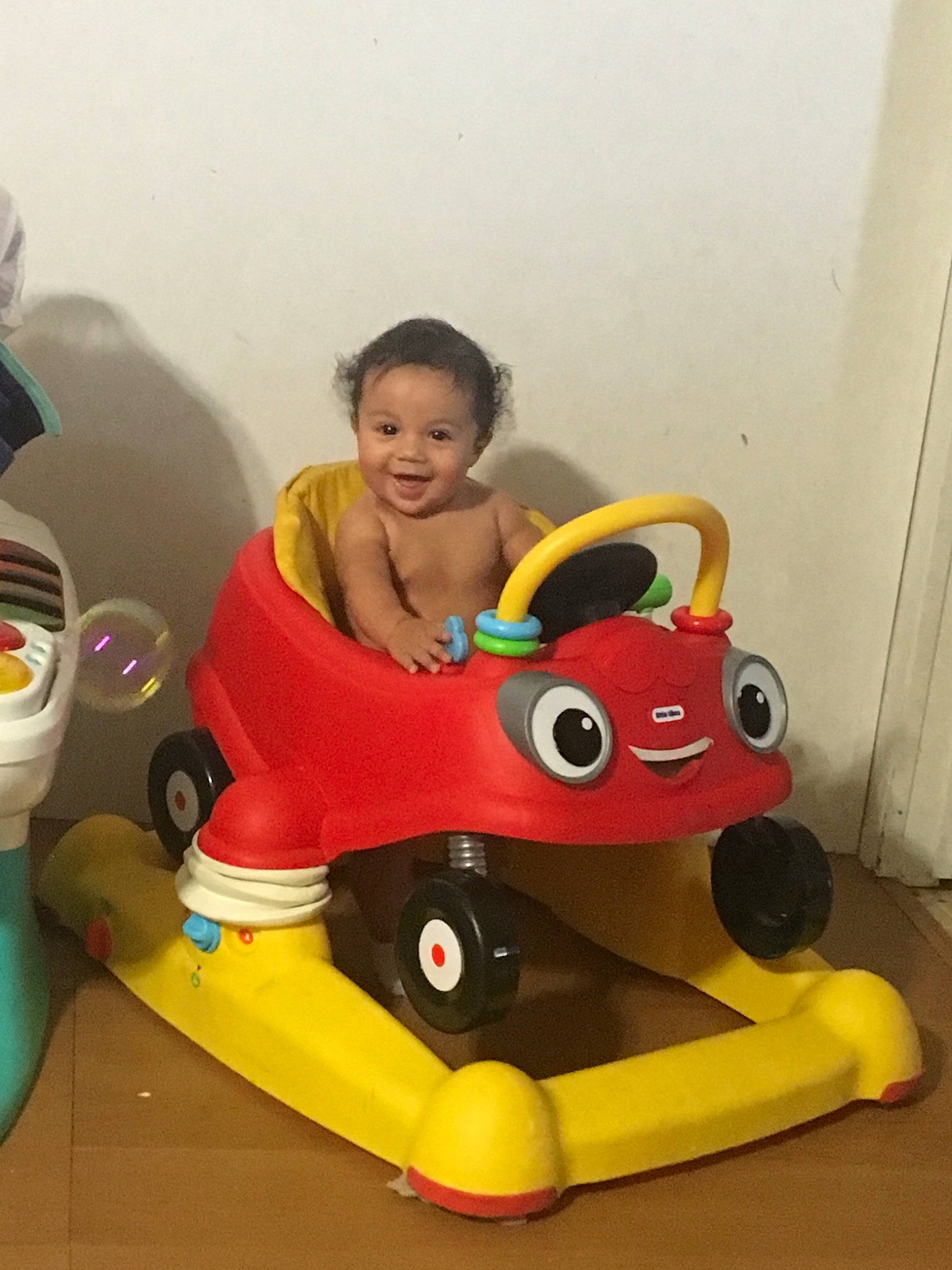 Mauricio is registered to the contest to win money with this photo: child, fun, joy, person, play, riding_toy, sitting, toddler, toy