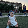 Sofia joined the competition — help win amazing prizes! baby, child, sports_field, soccer, grass, romper, headband, kids, playing, outdoor, evening, team, athlete, water_bottle, building, trees, sky, people, activity, field