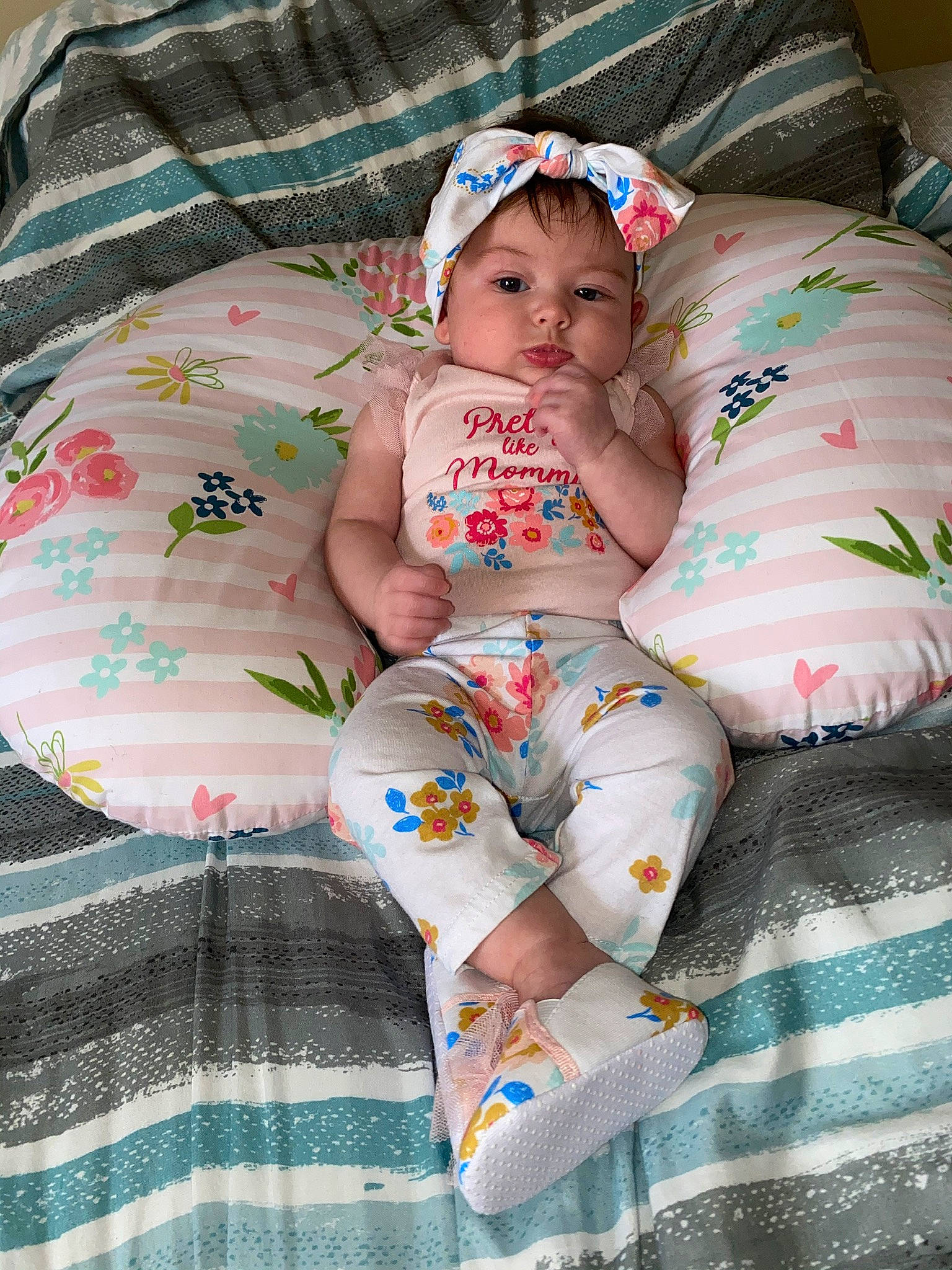 Delanie is registered to the contest to win money with this photo: baby, baby_toddler_clothing, beauty, child, headwear, linens, pattern, person, pink, skin, smile, textile, toddler