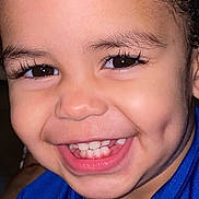 Willdrian joined the competition — help win amazing prizes! blue_shirt, cheeks, child, close_up, curly_hair, dimples, eyelashes, eyes, face, flash_photography, happy, indoors, joyful, mouth, nose, portrait, skin, smile, teeth, toddler