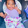 Jahmira joined the competition — help win amazing prizes! baby, child, infant, car_seat, headband, bunny_ears, purple_clothing, floral_pattern, drool, cute, smiling, playful, cushion, seat_belt, indoors, portrait, happy, skin, face, hands