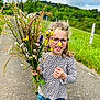 accessories, blouse, clothing, face, flower, flowerarrangement, flowerbouquet, glasses, grass, head, herbal, herbs, pants, path, person, petal, photography, plant, portrait, vegetation