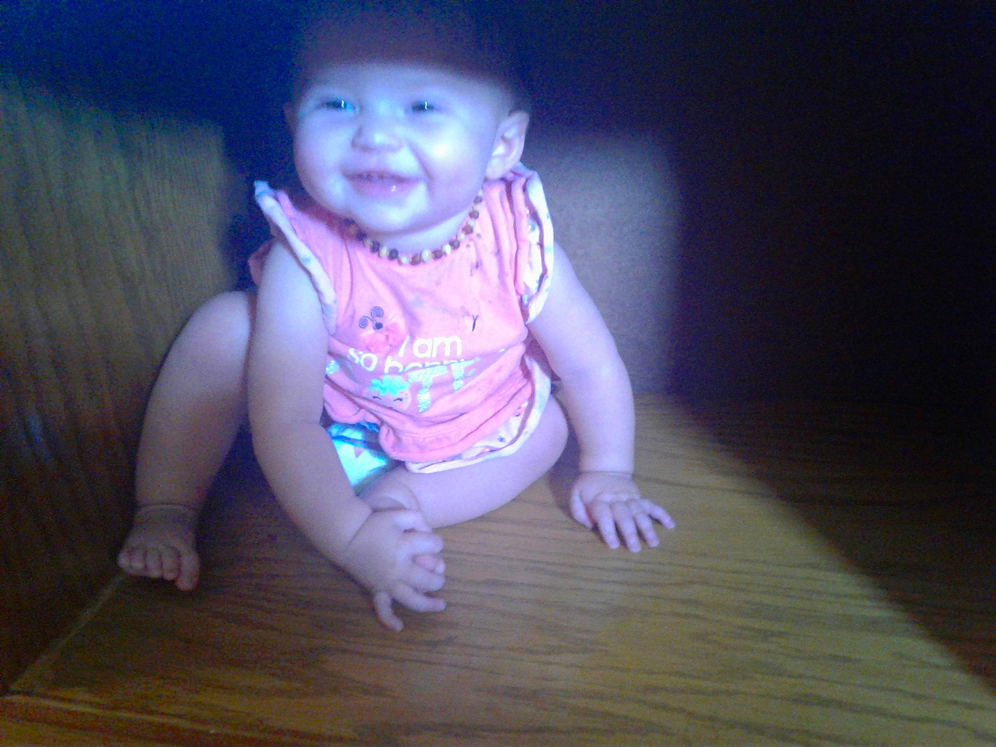 Arabella is registered to the contest to win money with this photo: baby, cheek, child, crawling, floor, flooring, fun, hand, head, person, pink, play, sitting, skin, smile, toddler