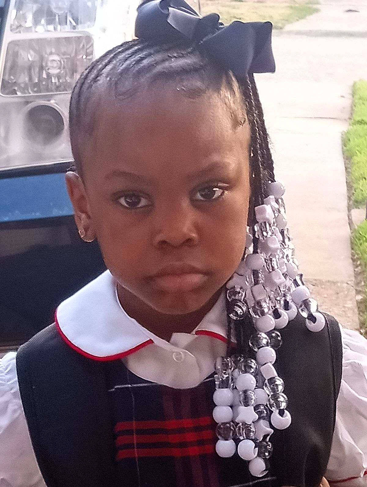 Ah'Mani De'Shay is registered to the contest to win money with this photo: beauty, child, chin, collar, dress, eyebrow, eyelash, eyewear, fashion_accessory, formal_wear, fun, hairstyle, happy, jewellery, lip, person, plant, tartan, toddler, uniform