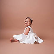 Renata joined the competition — help win amazing prizes! baby, child, smile, white_dress, headband, sitting, portrait, studio, cute, happy, infant, face, girl, elegant, fashion, young, adorable, background, skin, photography