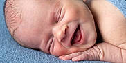 Beau joined the competition — help win amazing prizes! baby, newborn, sleeping, smiling, blue_blanket, infant, face, hand, skin, peaceful, closeup, portrait, soft_texture, cozy, cute, child, resting, happy, indoors, toddler