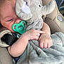 Beau joined the competition — help win amazing prizes! baby, pacifier, plush_toy, elephant, car_seat, blanket, child, infant, cuddling, soft_toy, seatbelt, cute, comfort, sleepy, hand, face, indoor, closeup, resting, young_child