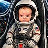 Connor joined the competition — help win amazing prizes! astronaut, baby, blue_eyes, child, cute, earth, expression, gloves, helmet, interior, portrait, seat, seatbelt, space, space_suit, spacecraft, straps, technology, window, young